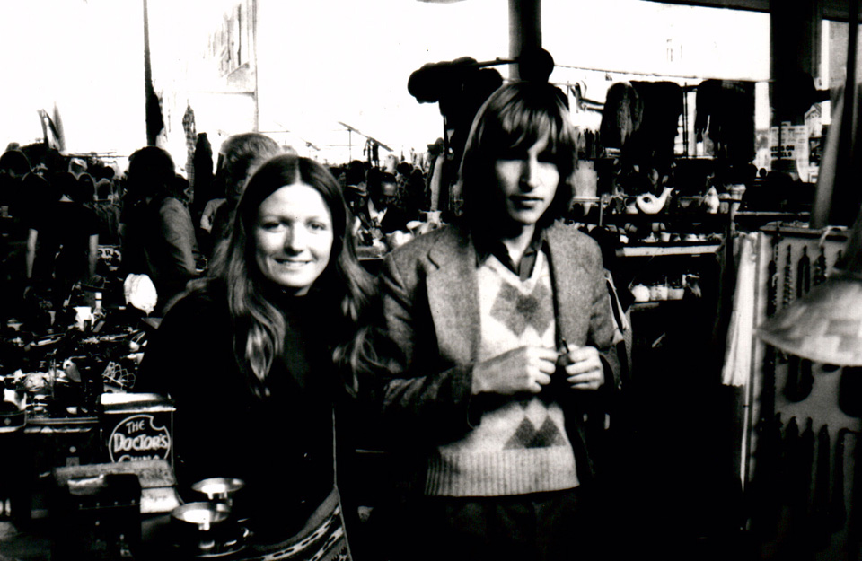 Olly and her then boyfriend (now husband) Nick, at their first stall under the Westway on the Portobello Road, early 1970s