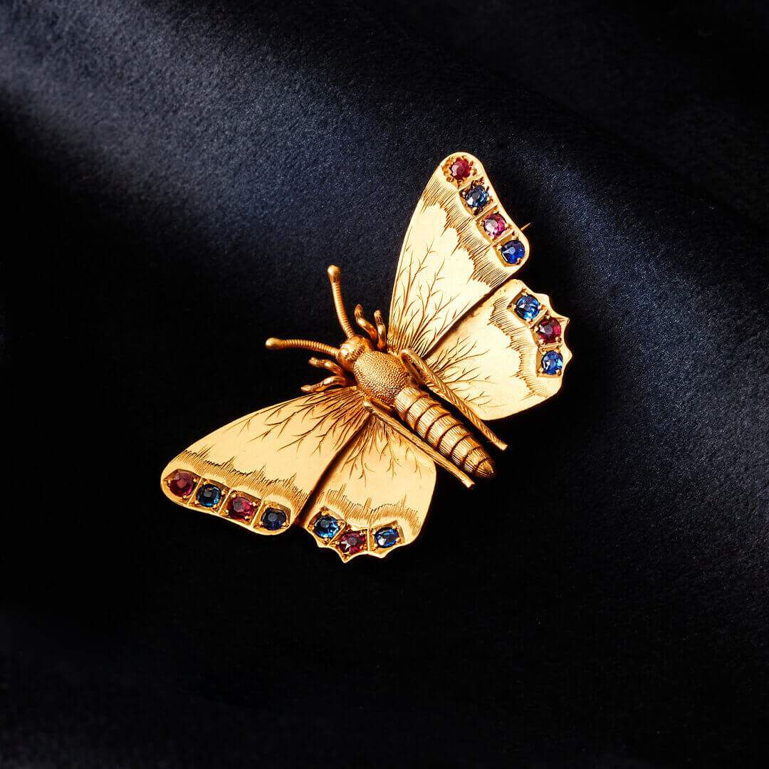 An Edwardian 15ct Gold Butterfly Brooch set with Rubies and Sapphires