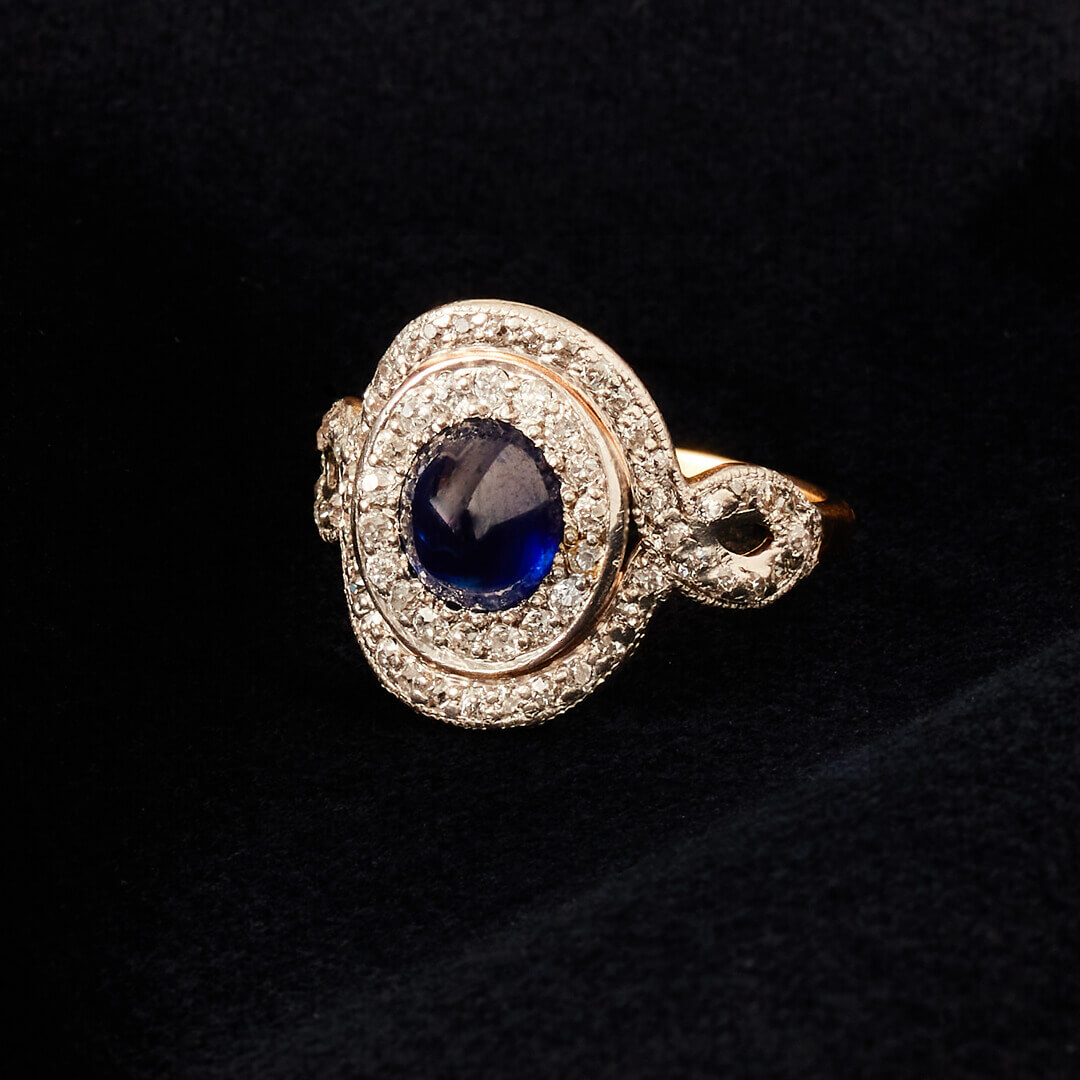 An Art Deco 18ct Gold and Platinum, Cabochon Sapphire and Diamond Cluster Ring by Bailey Banks & Biddle