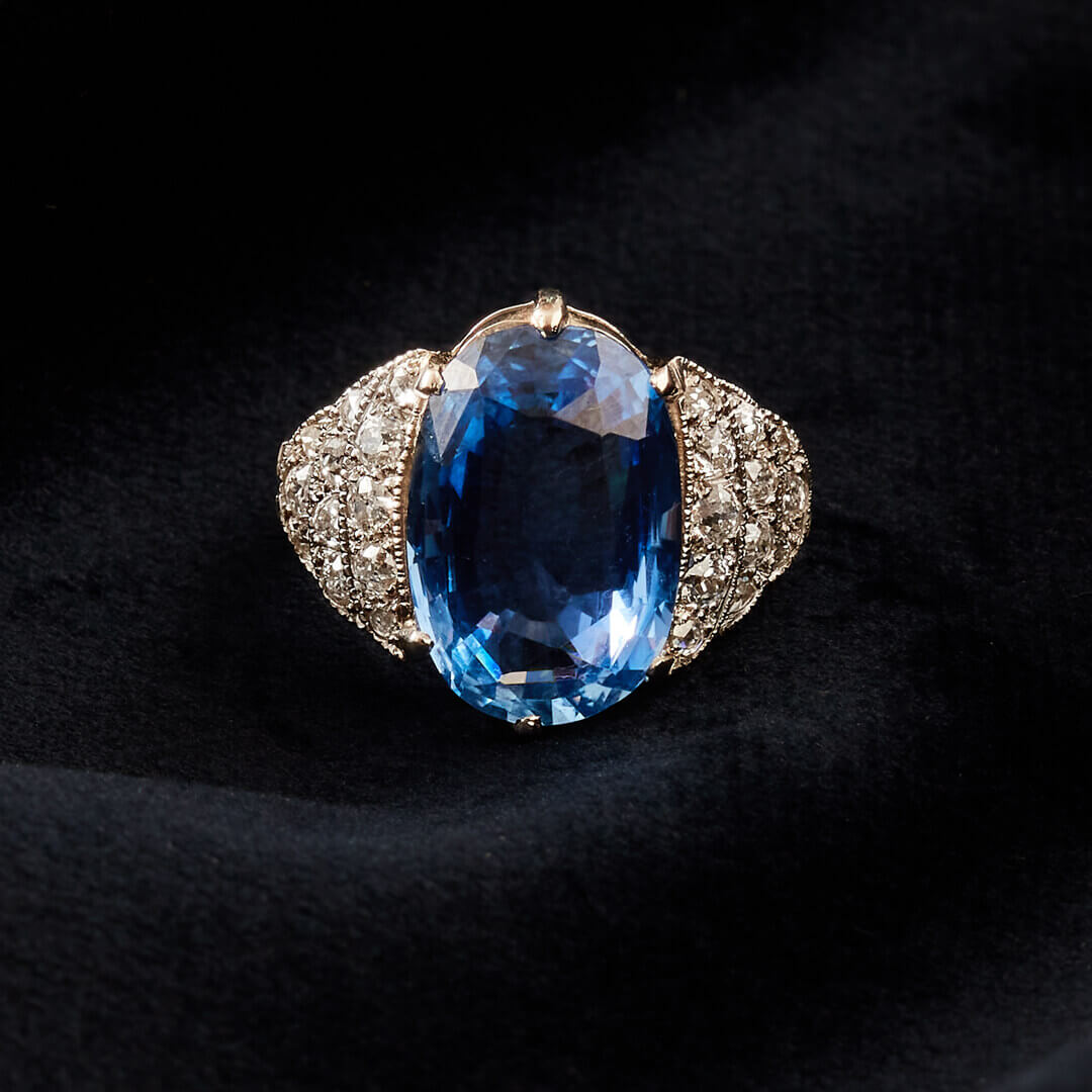 An Art Deco 18ct White Gold, Large Ceylon Sapphire Ring with Old Mine Cut Stepped Shoulders