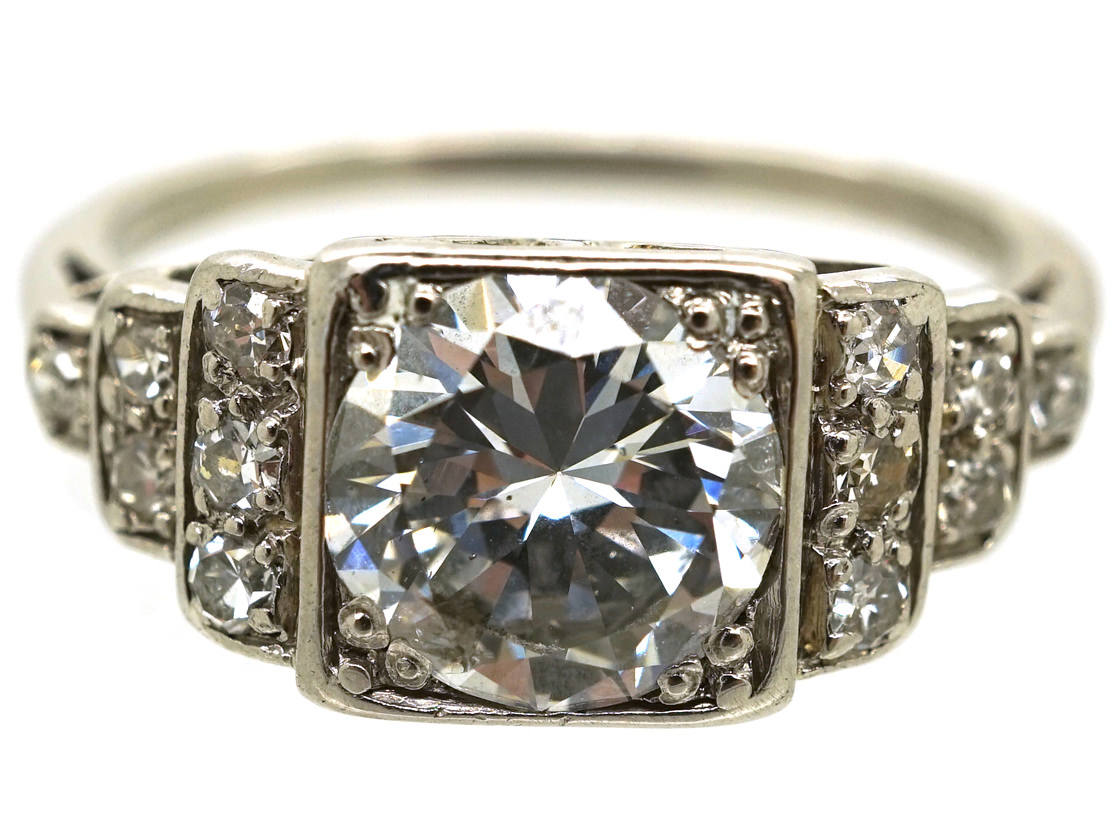 Palladium Single Stone Diamond Ring With Stepped Diamond Shoulders